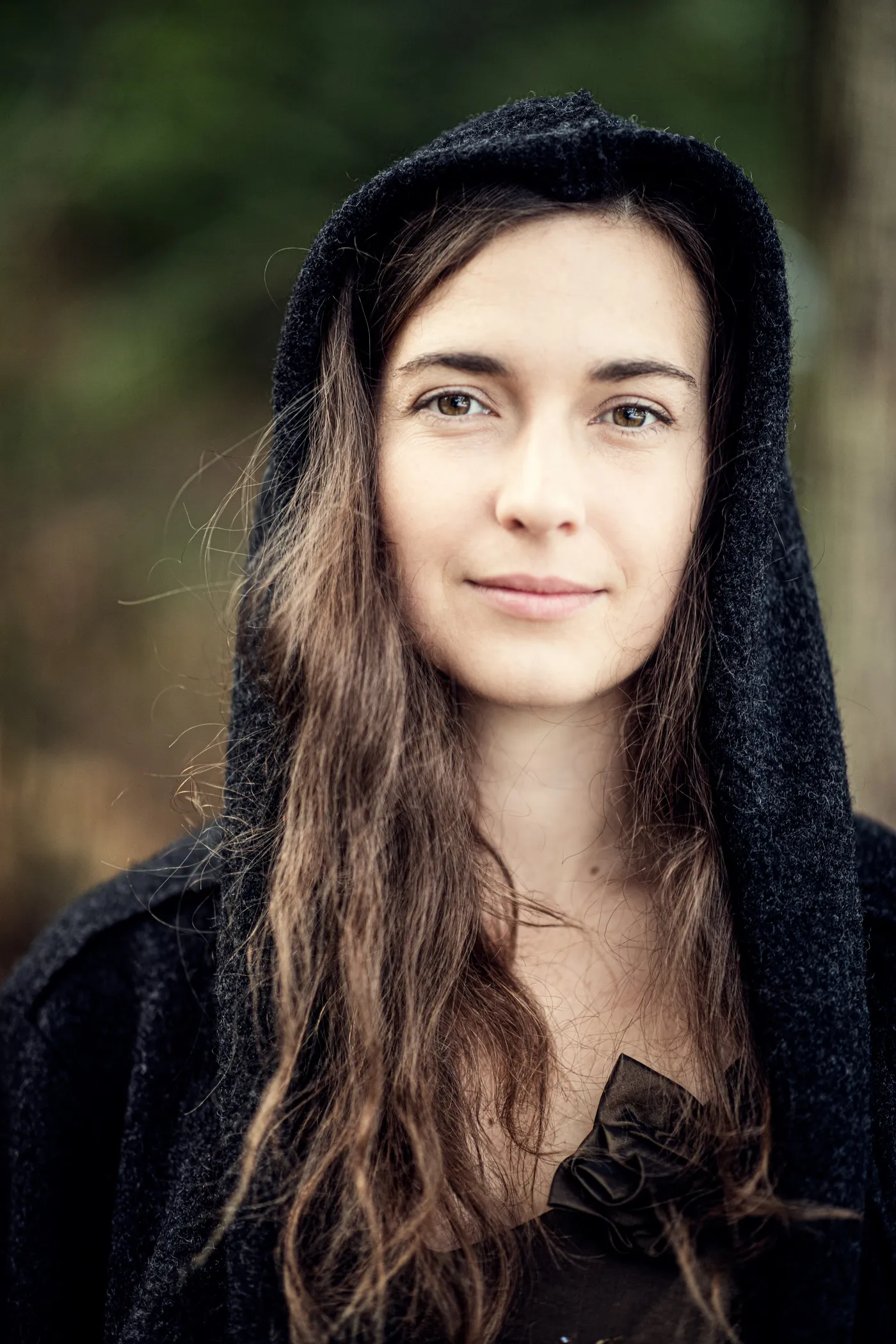 Barbora Xu facing the camera in a forest